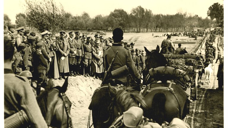 Old photograph of German soldiers advancing on Poland during World War II