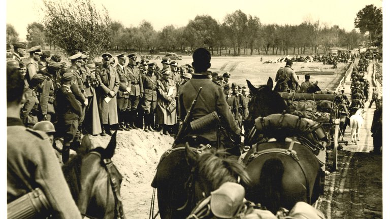 Old photograph of German soldiers advancing on Poland during World War II