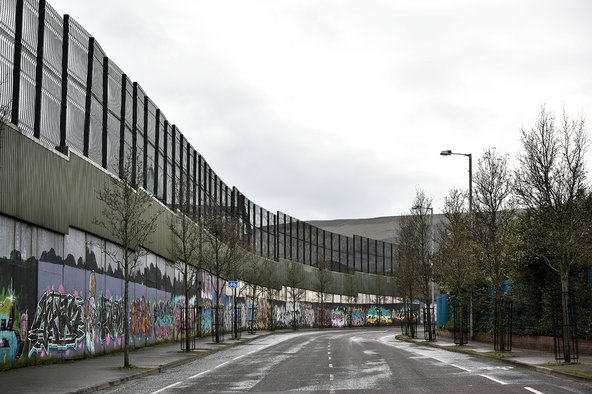 The peace wall which divides Catholic and Protestant communities in Belfast, Northern Ireland.