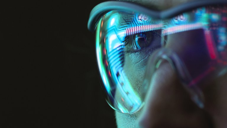 Reflection of circuit board on woman's goggles