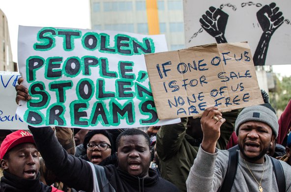 Demonstrators in Barcelona displaying posters against slavery in Libya. (Photo by Paco Freire/SOPA Images/LightRocket via Getty Images)