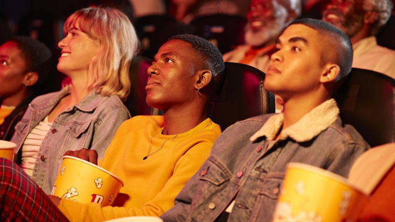 Audience watching movie in a cinema.