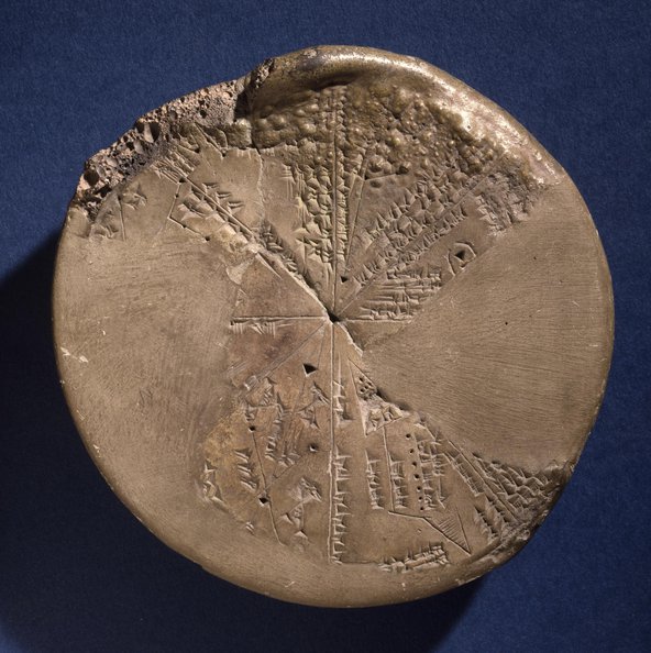 A circular clay tablet with depictions of planetary systems carved into it.