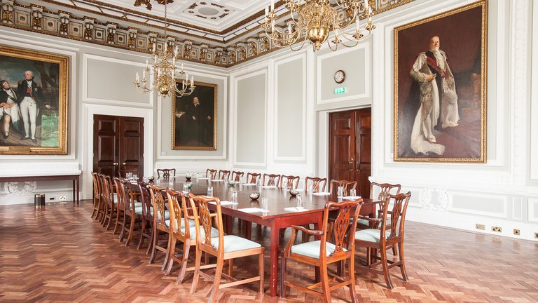 The Council Room at the British Academy, a historic room adorned with painted portraits on the walls