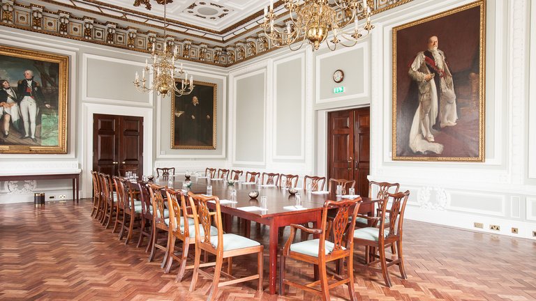 The Council Room, adorned with painted portraits on the walls