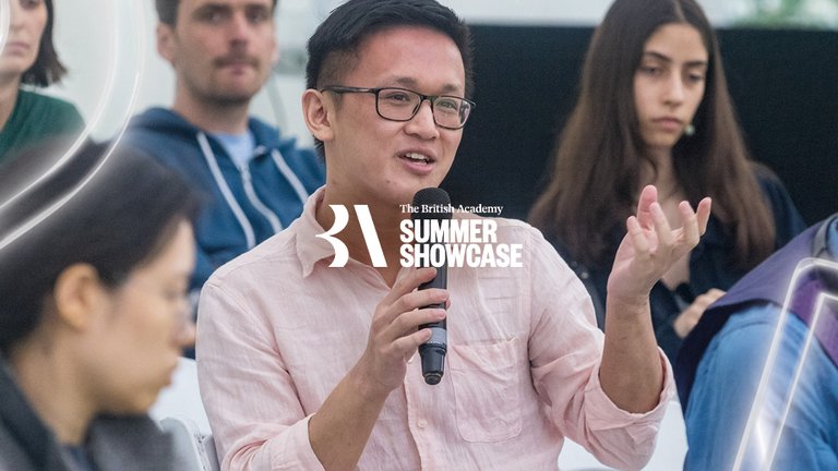 An audience member asks a question at a talk at the Summer Showcase