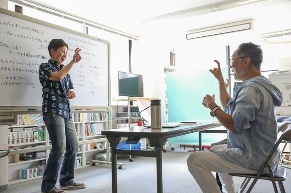 Sign language lesson with teacher and adult student