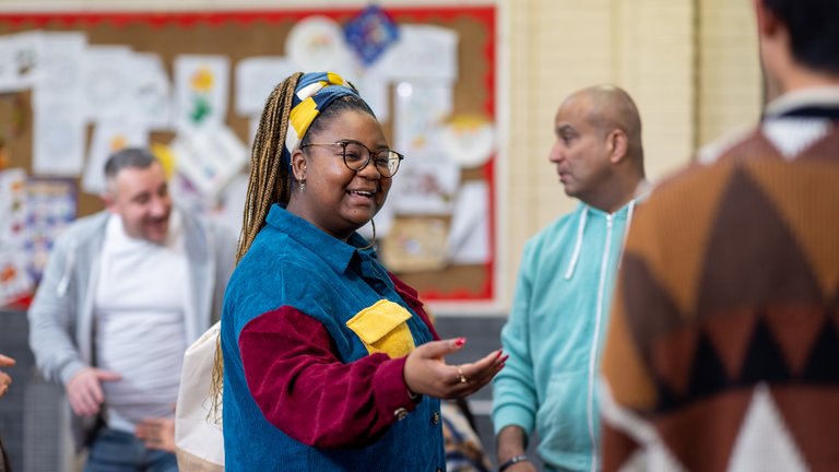 People greeting each other at a community centre in Seaton Deleval in the North East of England