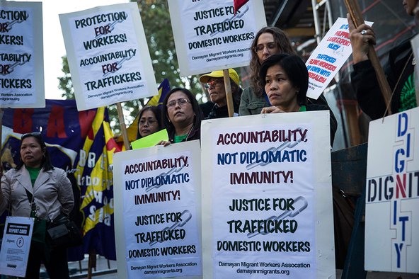 People protest against labor trafficking and modern day slavery outside the United Nations.