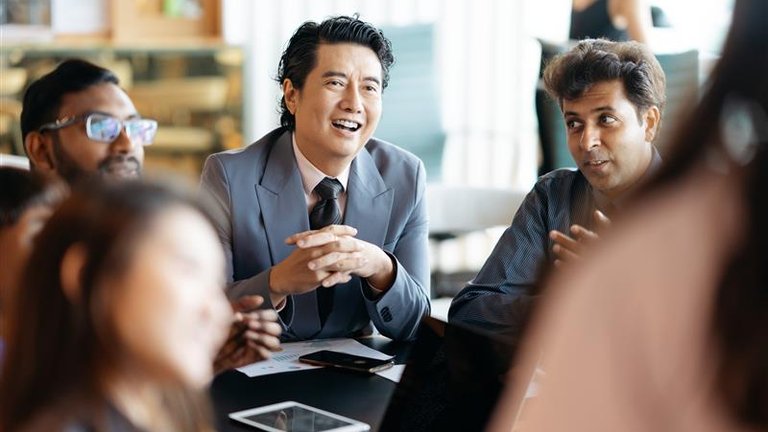Business colleagues listening to a presentation in the office