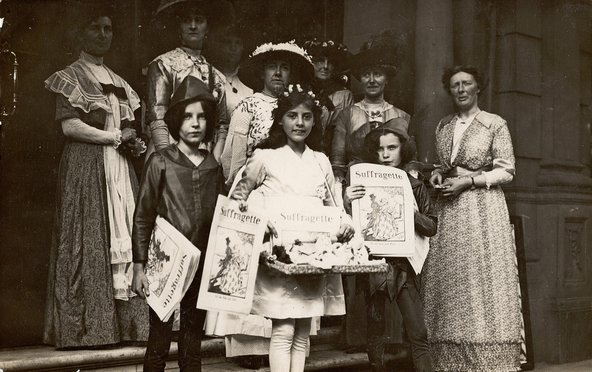 Group of children holding copies of