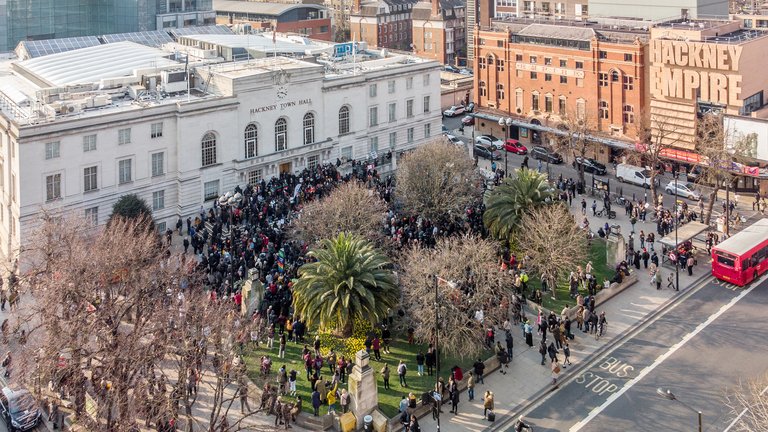 Hackney Town Hall and Hackney Empire, London, UK from a high angle perspective with a crowd