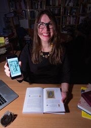 A photo of Kathryn M Rudy FBA with manuscripts