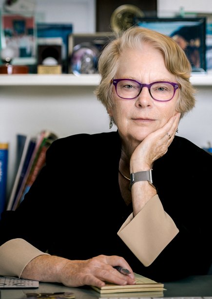 Image of Lynn Hunt looking at the camera while sitting at her desk