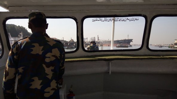 A soldier stands inside a ship in Karachi