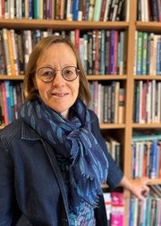 A photo of Sophie Gilliat-Ray FBA standing in front of a bookcase.