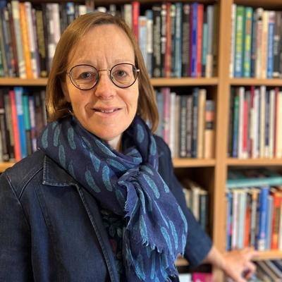 A photo of Sophie Gilliat-Ray FBA standing in front of a bookcase.