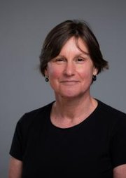 A photo of Miriam Meyerhoff FBA against a dark grey background.