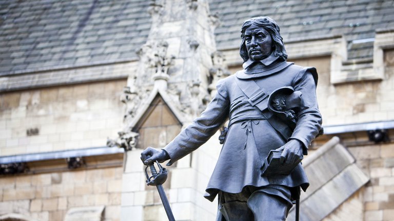 Statue of Oliver Cromwell in front of the Palace of Westminster, London, UK.