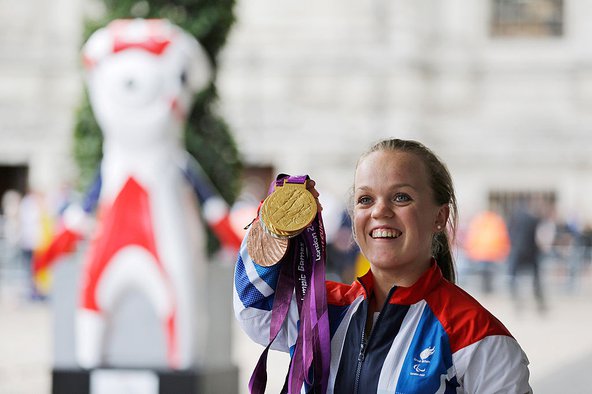Paralympics GB gold medallist swimmer Ellie Simmonds poses with her medals before attending a reception for Team GB and Paralympic GB athletes. Photo by Lefteris Pitarakis - WPA Pool/Getty Images.