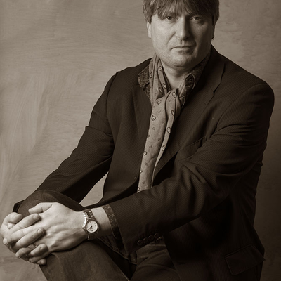 Sepia-tone portrait photo of Professor Simon Armitage Hon FBA