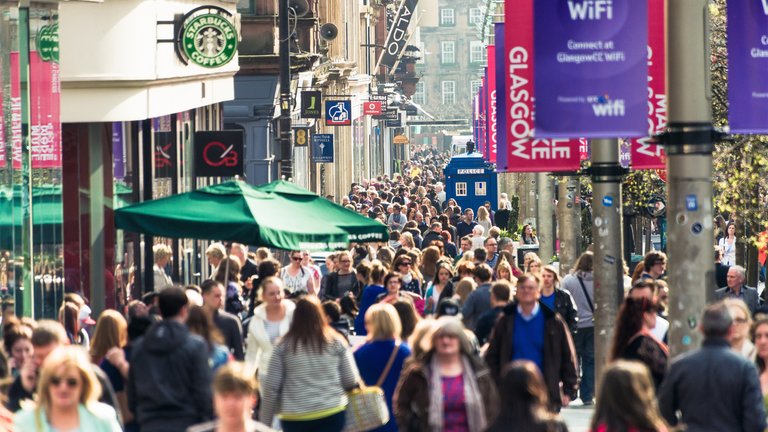 A photograph of crowds of people walking on Glasgow's Buchanan Street