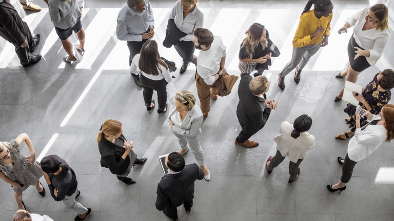 A crowd of people in businesswear