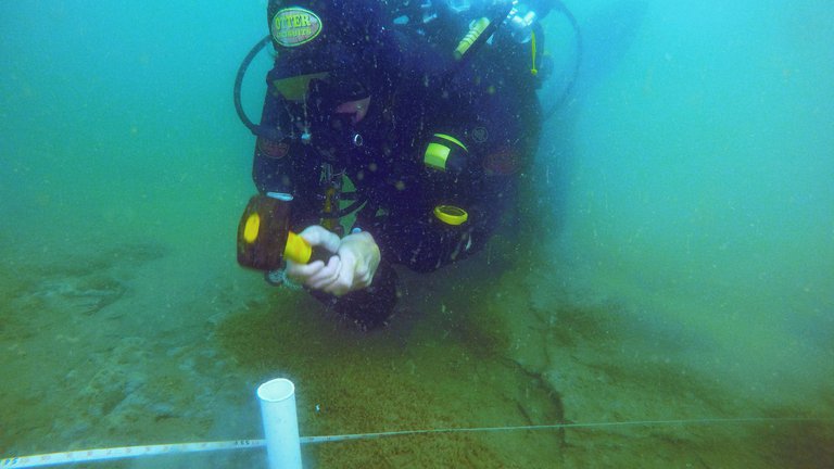 Diver hammering sample tube into Pleistocene deposits for palaeoenvironmental sampling. Credit: Dr Rachel Bynoe