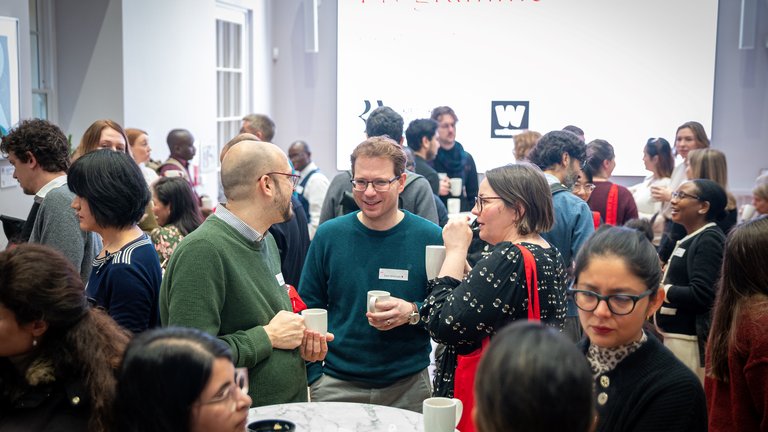 A room of ECR Network members networking