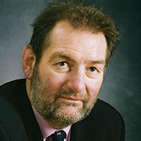 Professor Sir Ian Diamond FBA photographed looking into the camera, wearing a suit and tie.