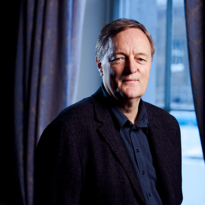 Portrait of Patrick Wright standing in front of window