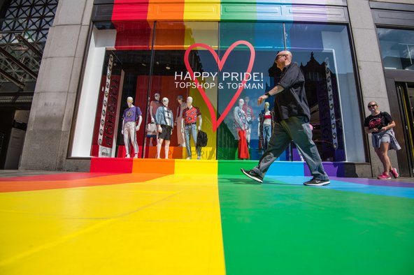 The Pride Festival takes place in London annually, with many shops decorating their stores with Pride flag colours. Image credit: Carl Court / Getty Images.