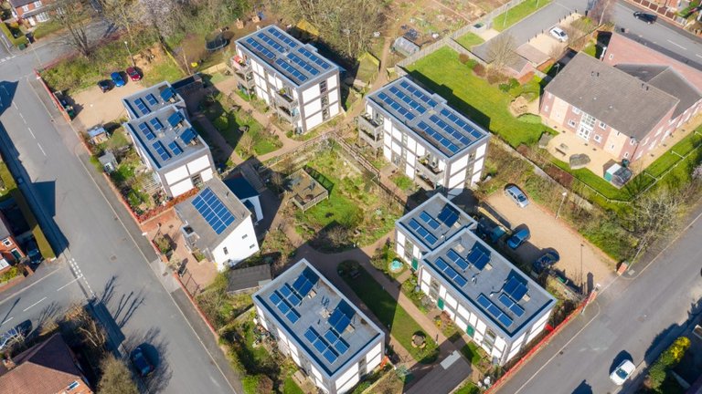 Arial view of solar panels atop buildings