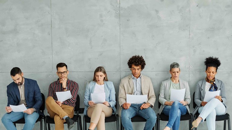 A group of researchers reading papers