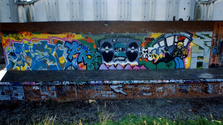 Colourful music themed graffiti on a wall in Exeter