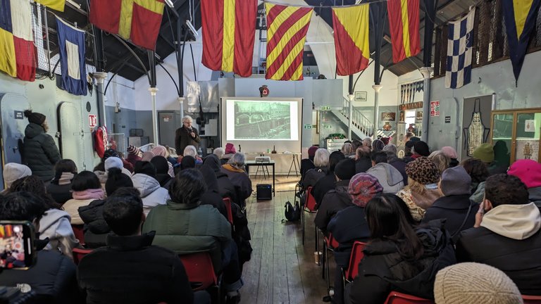 An audience watching a talk